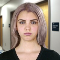 Claire Rivas Unsmiling teen girl with dyed blonde hair
